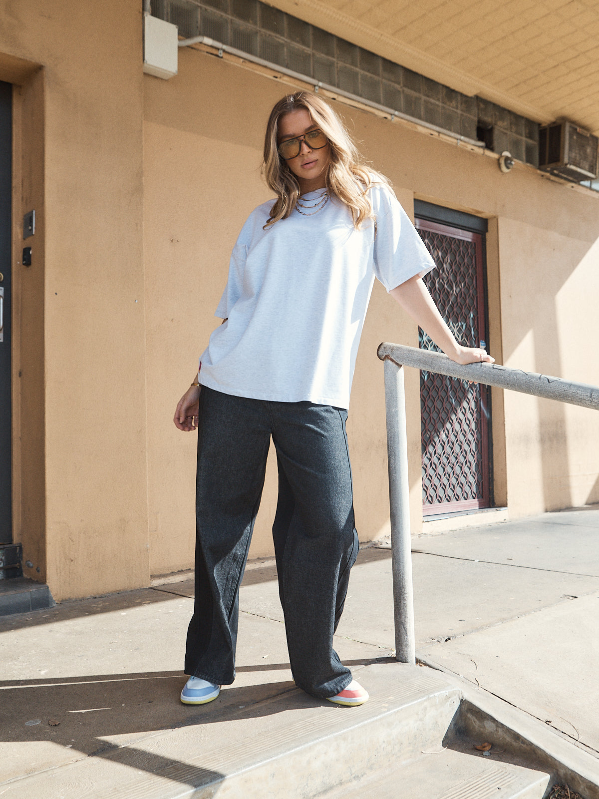 Casual streetwear outfit featuring oversized grey marle heavy jersey tee with woven 72 patch.