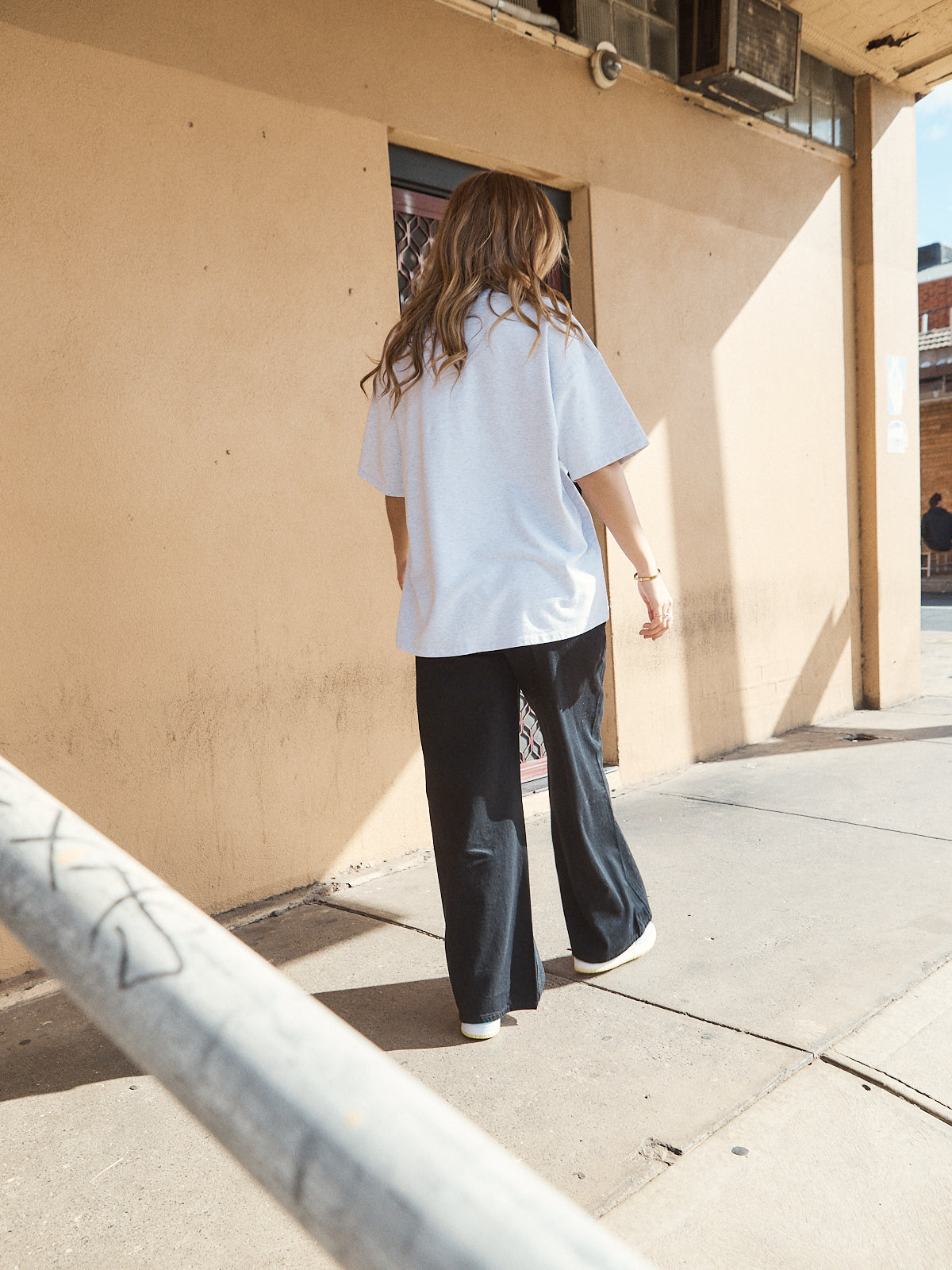 Casual streetwear outfit featuring oversized grey marle heavy jersey tee with woven 72 patch.