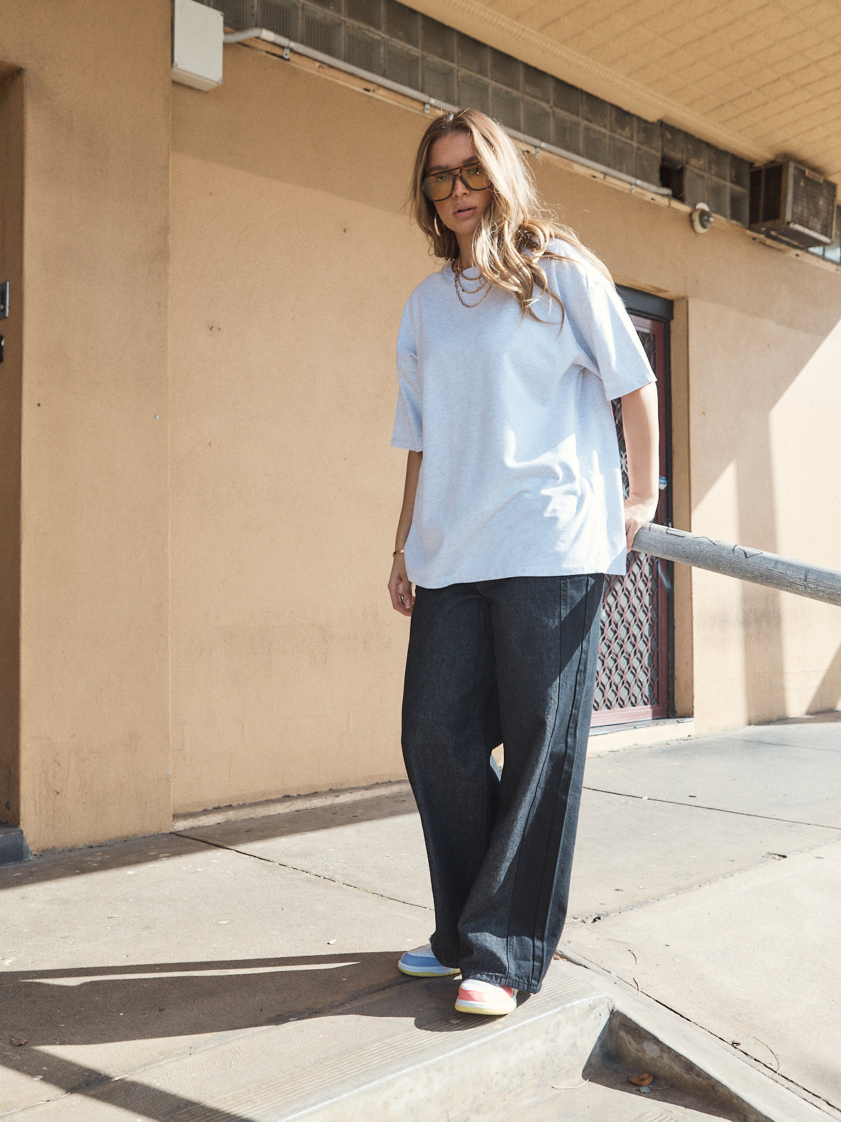 Casual streetwear outfit featuring oversized grey marle heavy jersey tee with woven 72 patch.