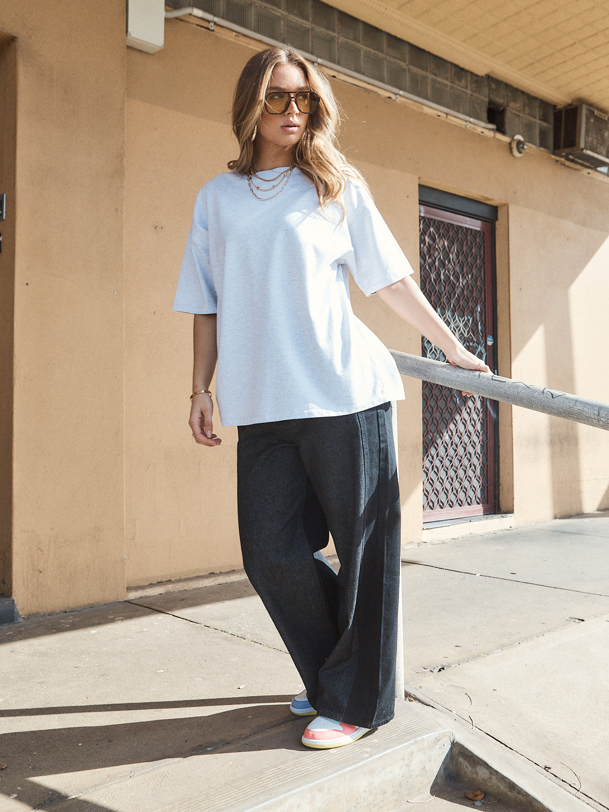 Casual streetwear outfit featuring oversized grey marle heavy jersey tee with woven 72 patch.